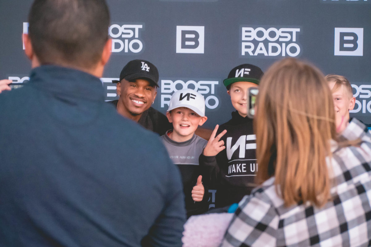Kids with Neal in front of the BOOST Wall